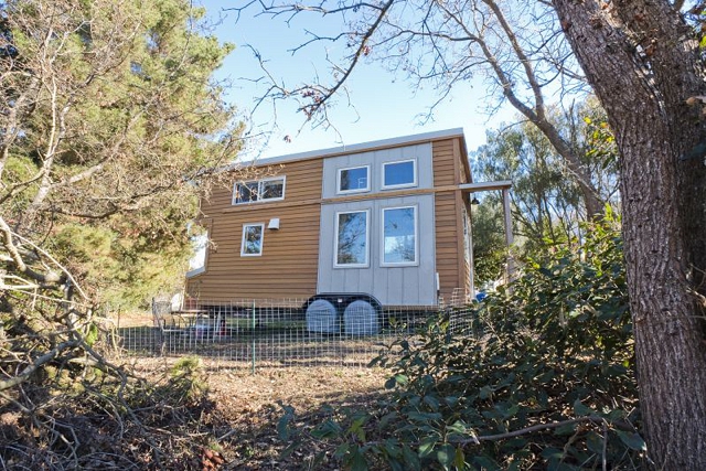 a tiny two story home on a trailer