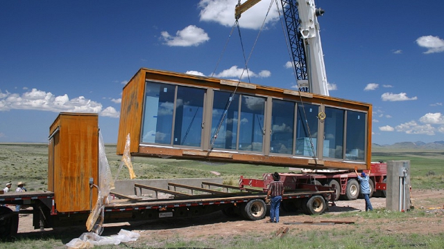 weehouse in marfa texas on crane for truck delivery