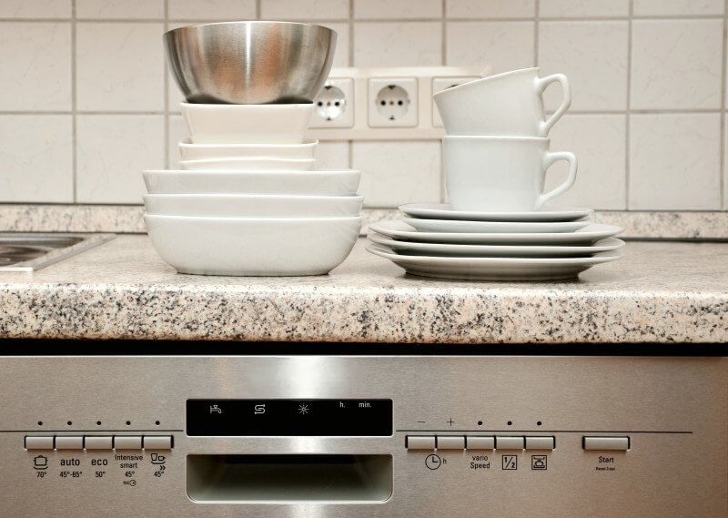 plates stacked on dishwasher