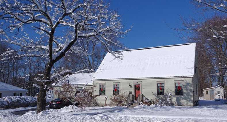 new hampshire home with snow cover